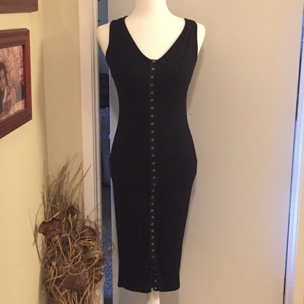 Sleeveless Black Long black snap down midi dress.